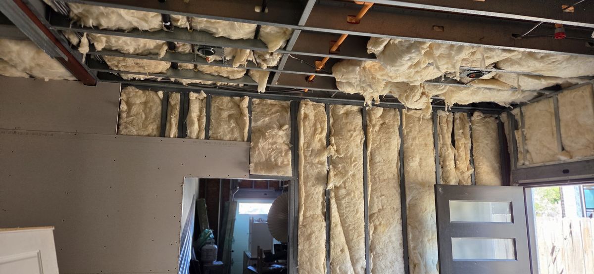 Framing and insulation at a new doorway.