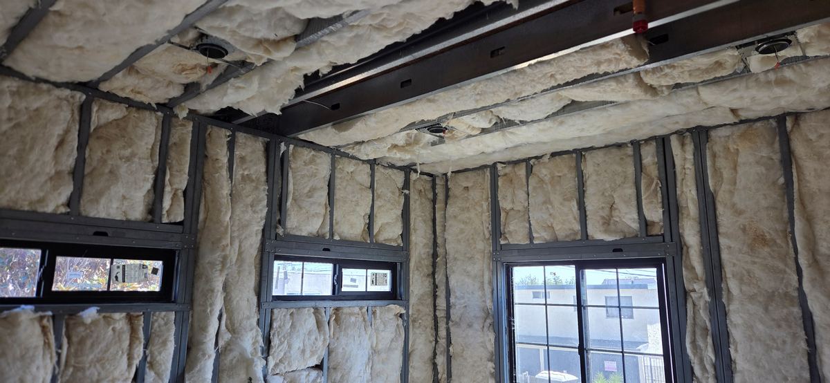 Commercial shell insulated and framed to the windows.