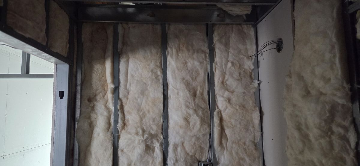 Insulation set in the cavity before board goes on.