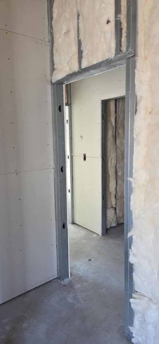 Openings framed and boarded ready for doors.