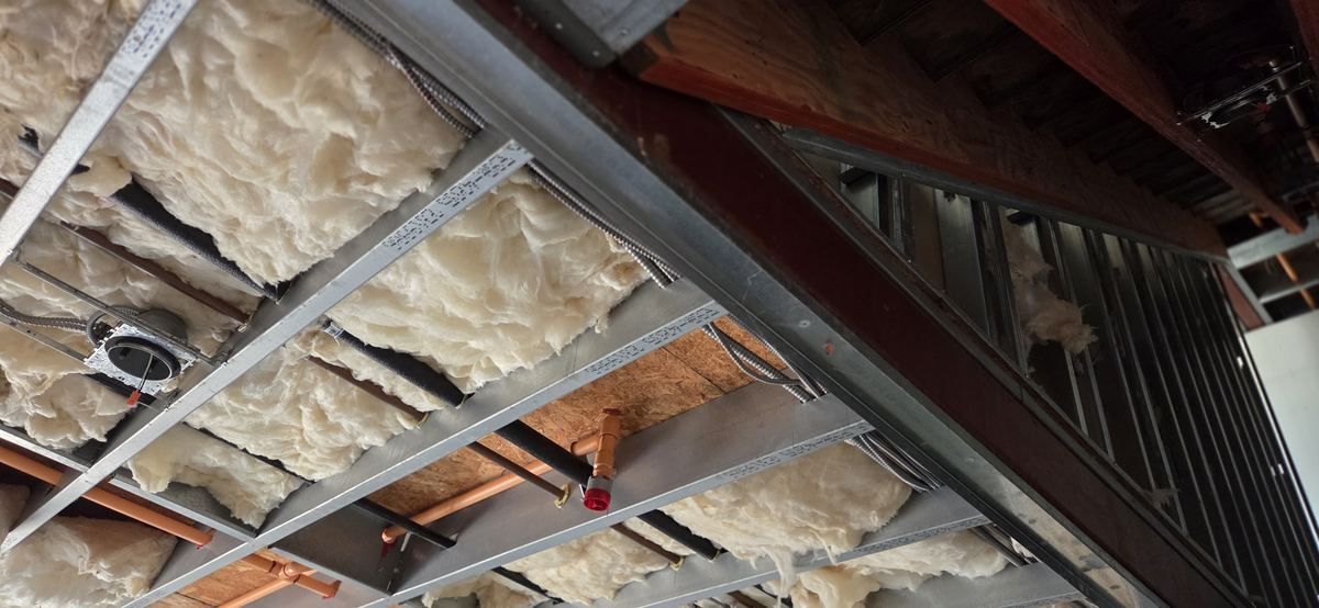 Steel joists and insulation before the ceiling is closed.